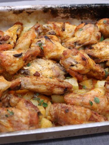 Cooked wings in roasting tin