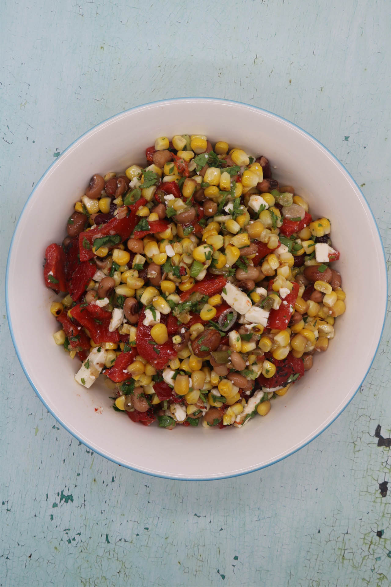 Grilled sweetcorn salad with feta in large serving bowl