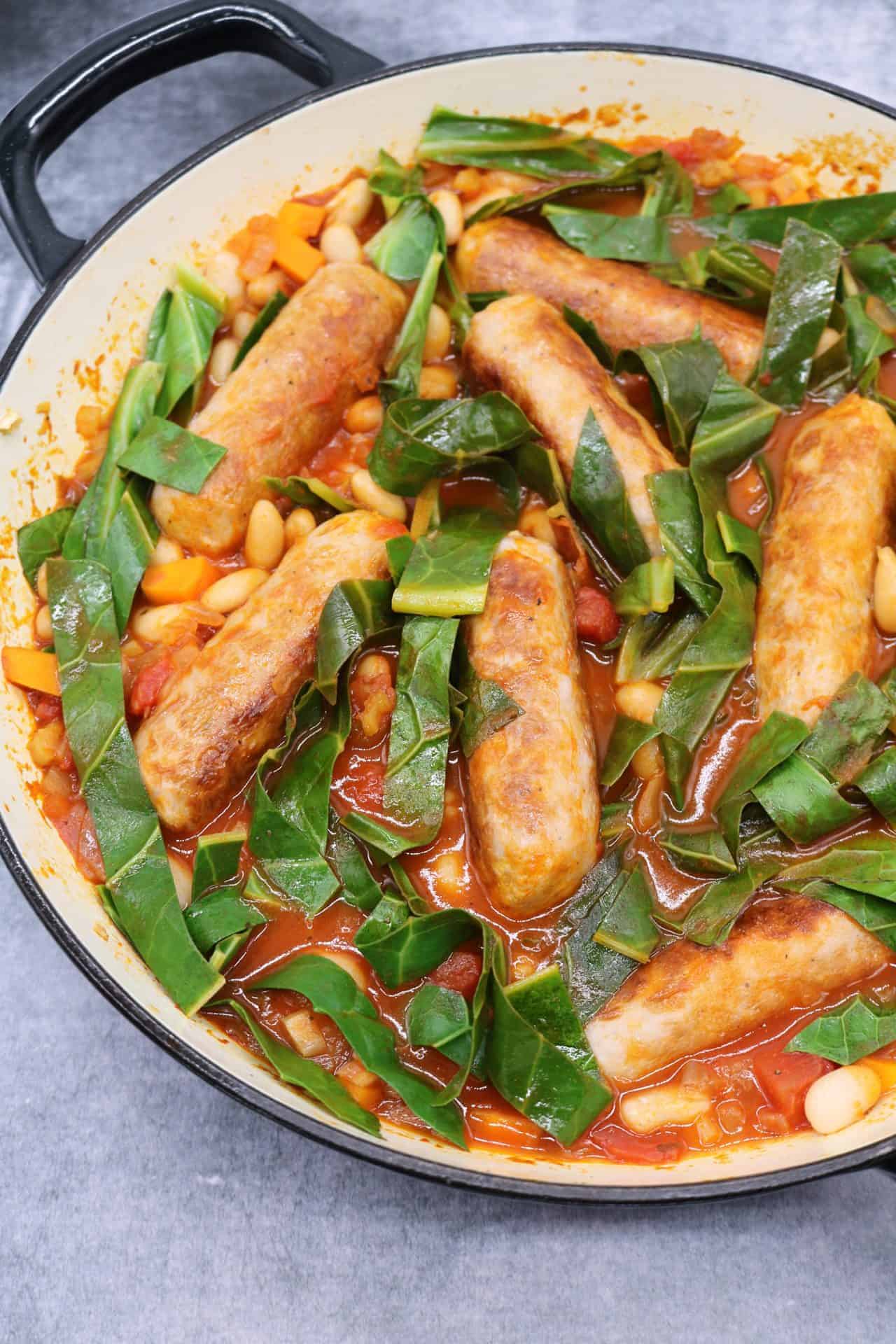 Sausage and cannellini bean casserole in large round casserole