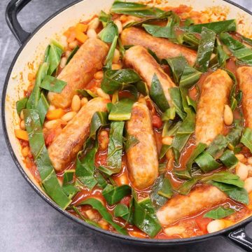 Sausage and cannellini bean casserole in large round casserole