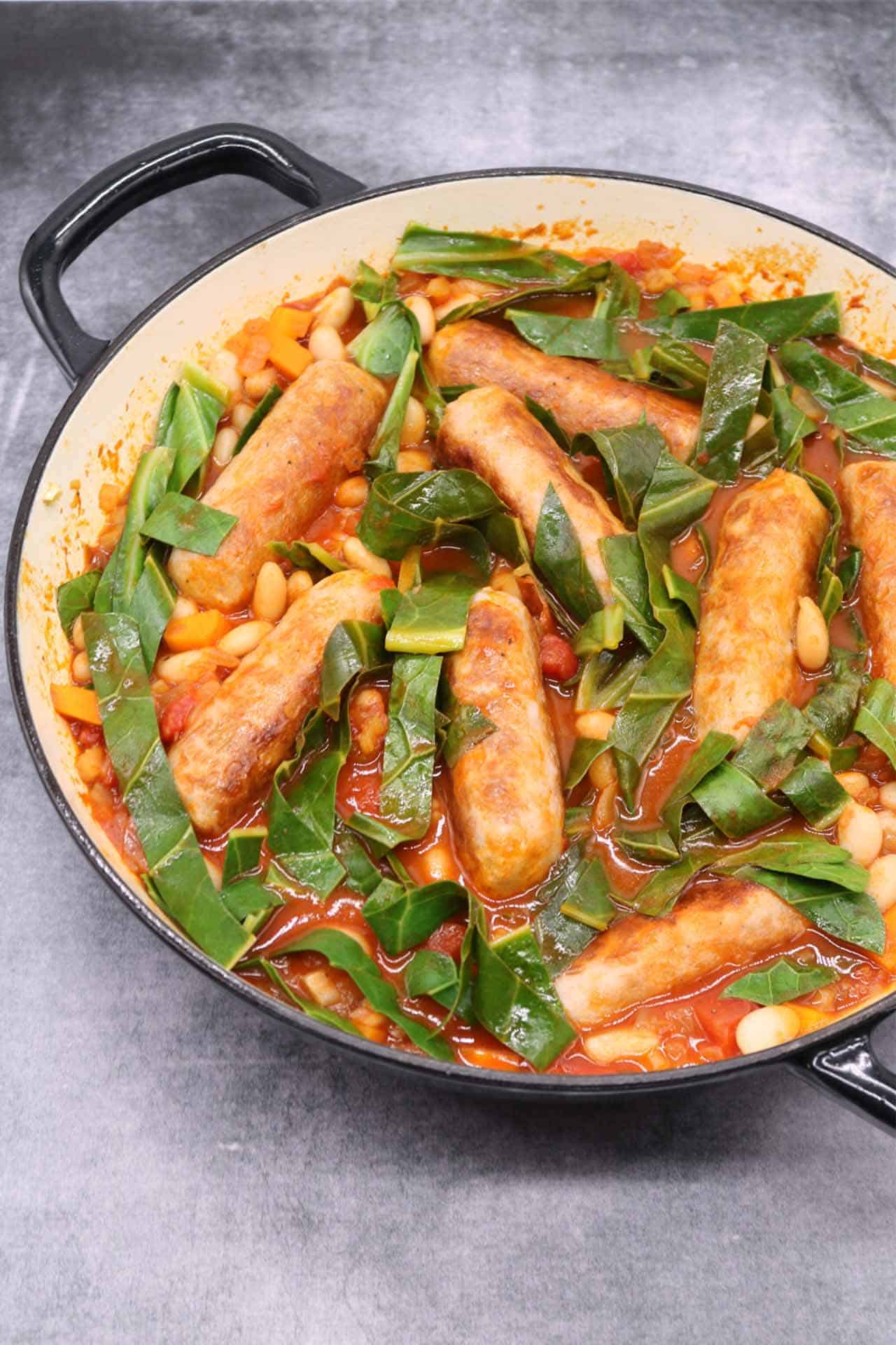 Sausage and cannellini bean casserole in large round casserole