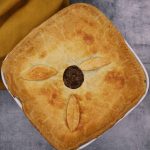 Minced beef and onion pie in square white dish