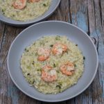 Risotto with courgette and prawns in grey bowls