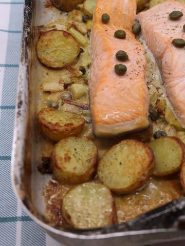 Creamy salmon leek and potato in rectangle roasting dish