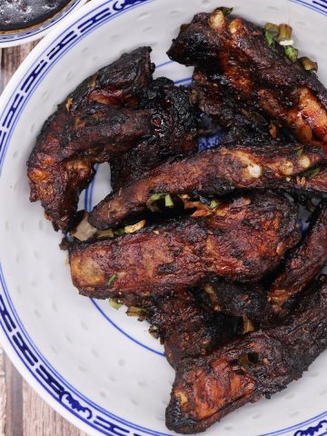 Five spice baked ribs in blue and white bowl