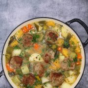 Lamb meatball cawl in large round casserole