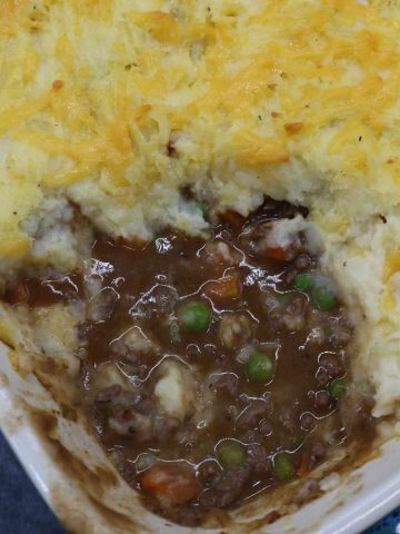 Close up of cottage pie with portion removed