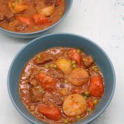 Two bowls of slow cooker old fashioned stew in green bowls