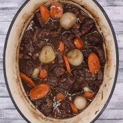 Close up of Beef Bourguignon in oval casserole dish