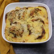 Savoy gratin with herby cheddar crumb in square oven dish