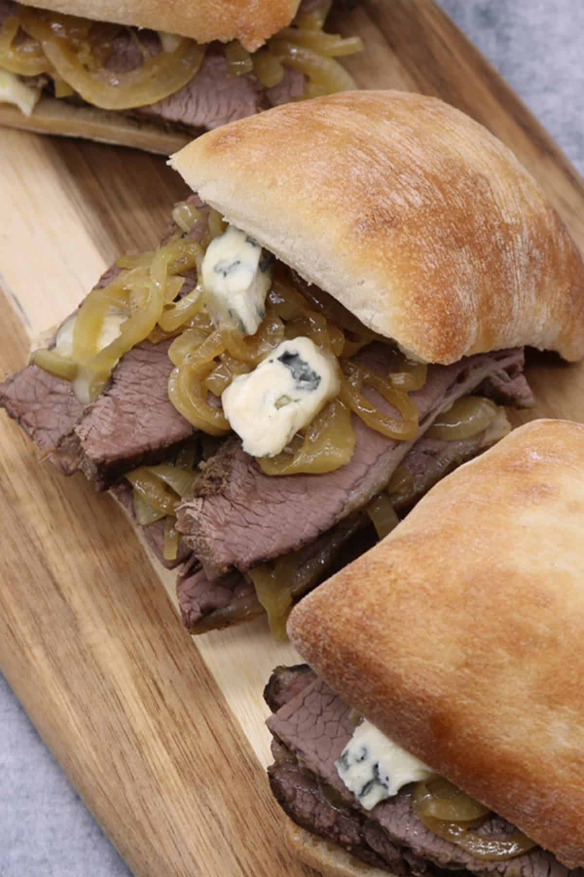 Brisket Sandwiches with Beer Onions and Blue Cheese
