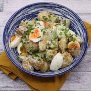 Jersey royal potato salad in blue and white bowl