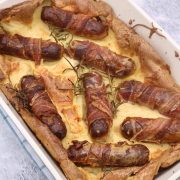Herb and mustard toad in the hole in rectangle oven dish