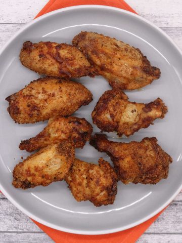 Easy air fryer cajun chicken wings in grey bowl