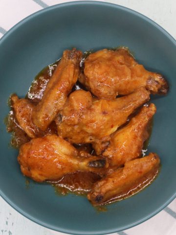 Easy air fryer piri piri chicken wings in green bowl