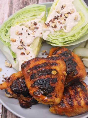 BBQ buffalo chicken thighs with lettuce wedges