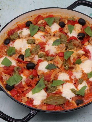 Chicken rice with tomato, basil and mozzarella in large round casserole