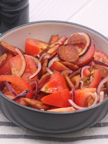 Chorizo and tomato salad in bowl