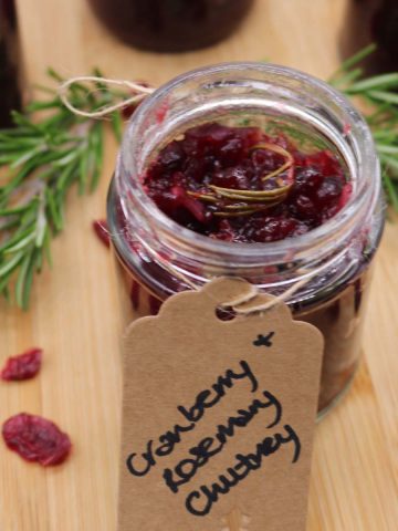Jar of cranberry and rosemary jam with gift label