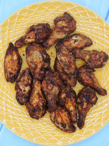Easy air fryer spanish chicken wings on yellow plate