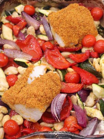 Chorizo crusted cod in baking tray with roast vegetables