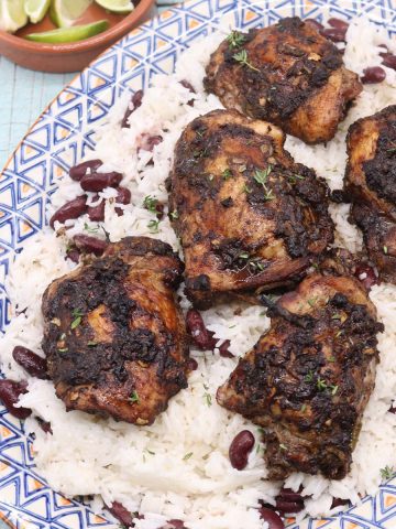 jerk coconut chicken and coconut rice on oval platter