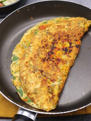 Masala omelette in frying pan
