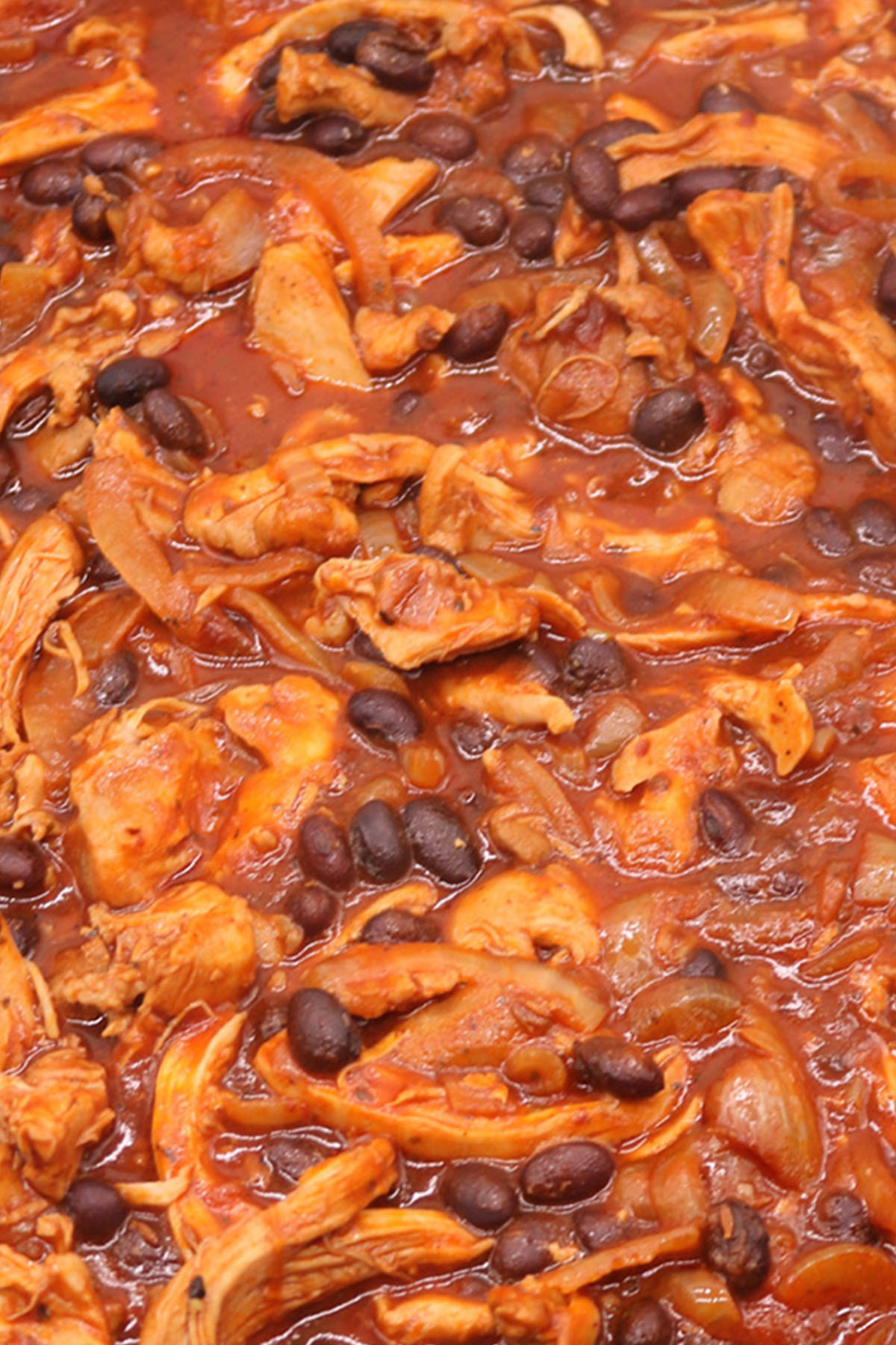 Close up of pulled chicken and black bean chilli