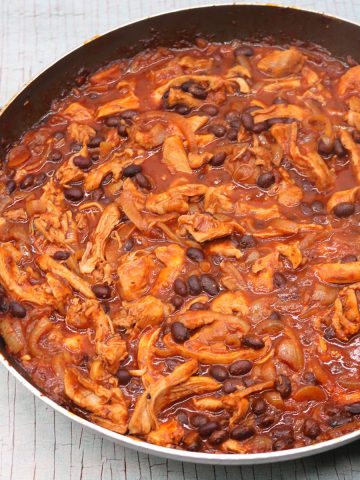 pulled chicken and black bean chilli in large round frying pan