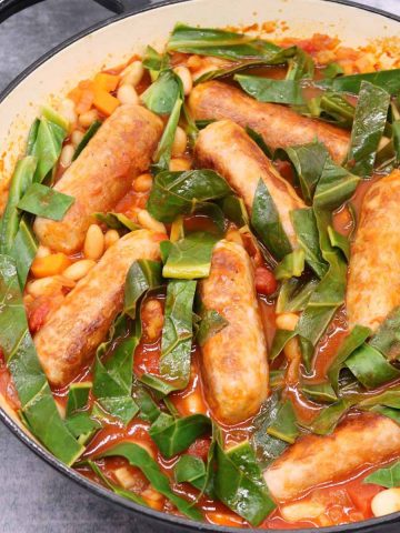 Sausage and cannellini bean casserole in large round casserole dish