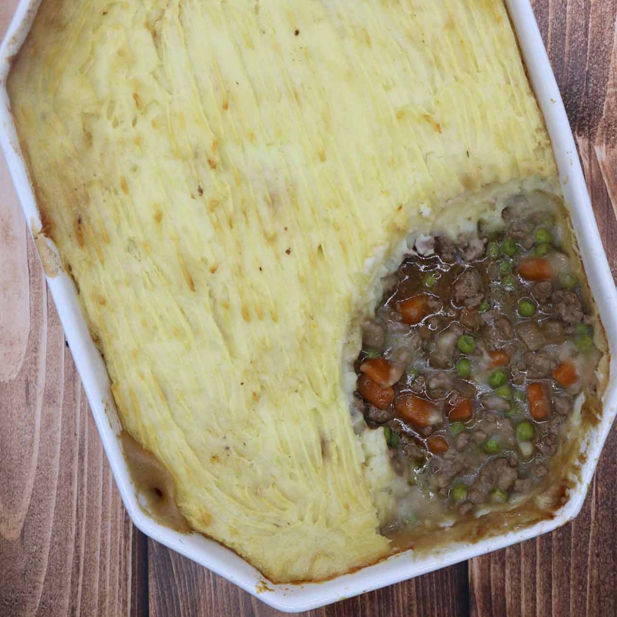 Shepherds pie in rectangle oven dish with slice removed