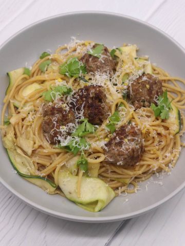 Summer meatballs with spaghetti in grey bowl