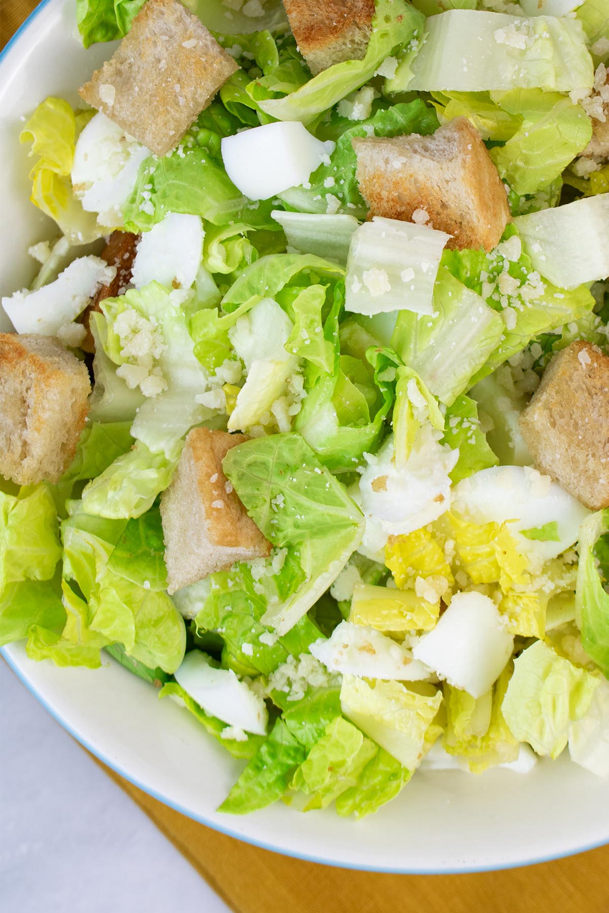 Close up of caesar salad in a serving bowl