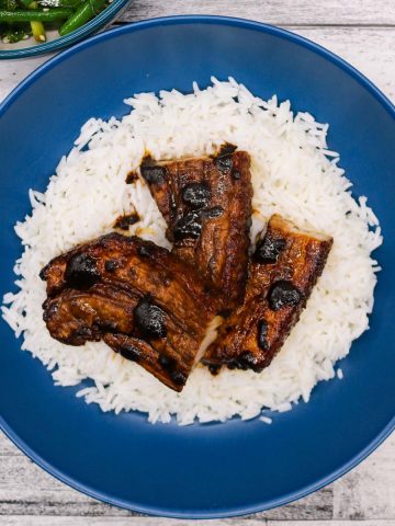 Char sui pork in blue bowl with rice