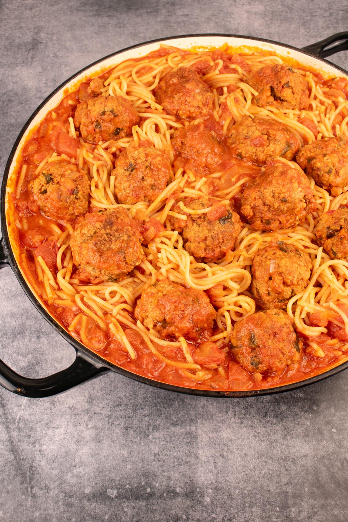 'Nduja meatballs with spaghetti in large round casserole